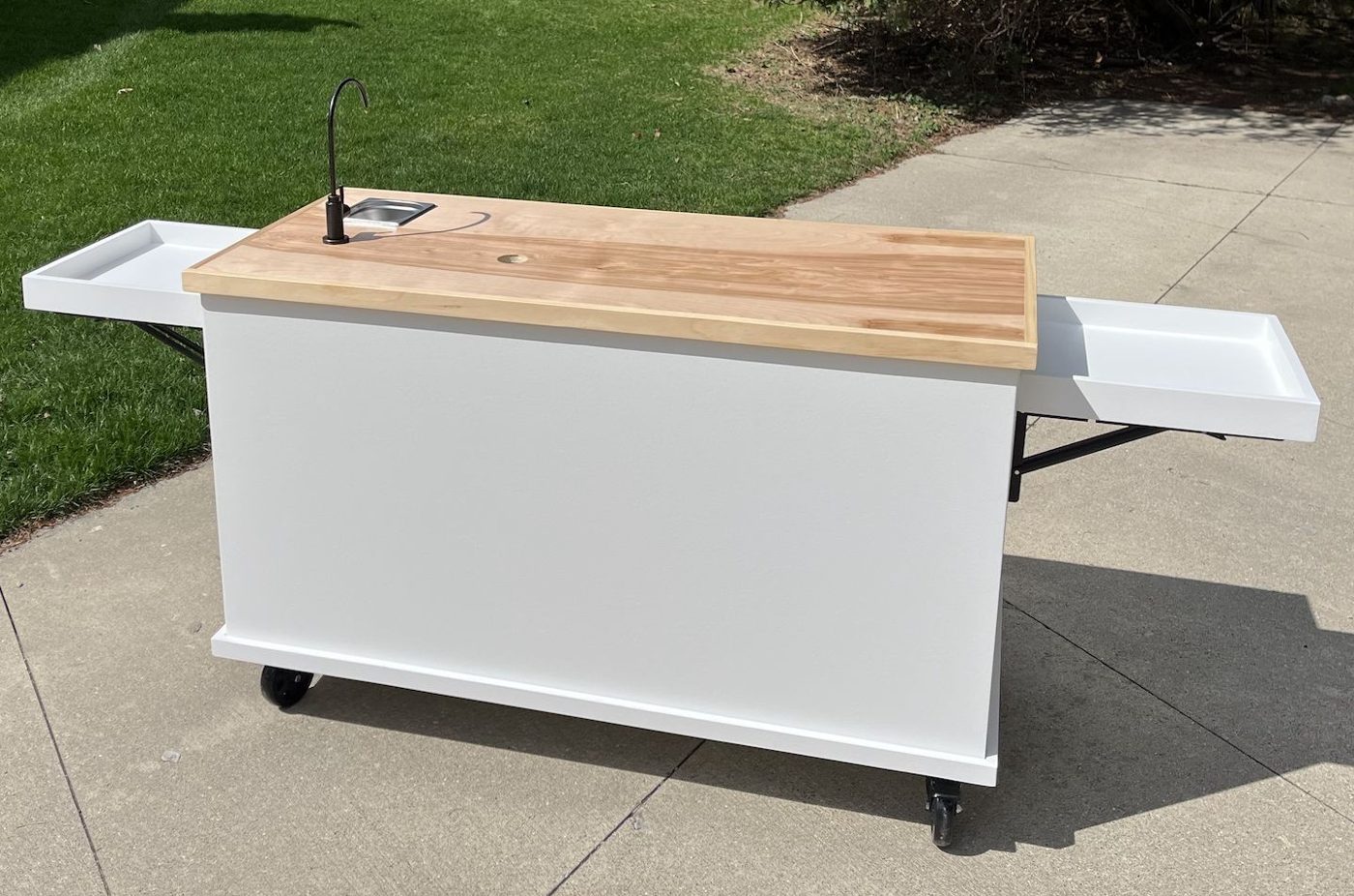 Front of the Signature Wood-Top coffee and serving cart: a clean white base with a natural wood top and a collapsible serving shelf
