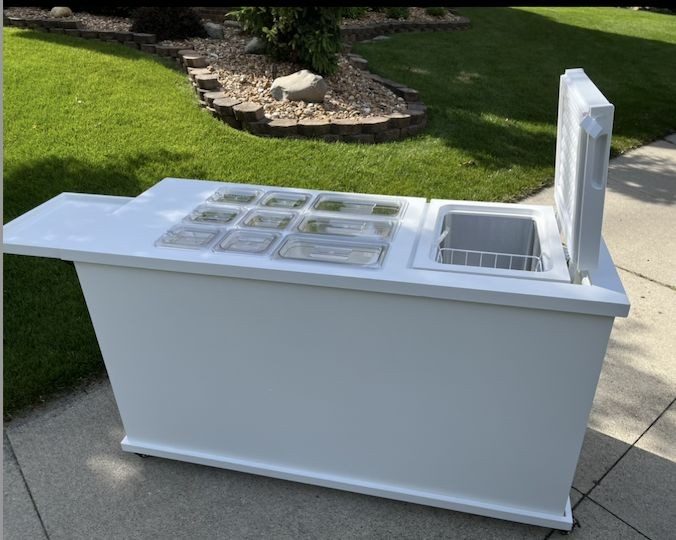 White frozen treats and dessert cart with acrylic wells, a slide-in freezer and a collapsible shelf