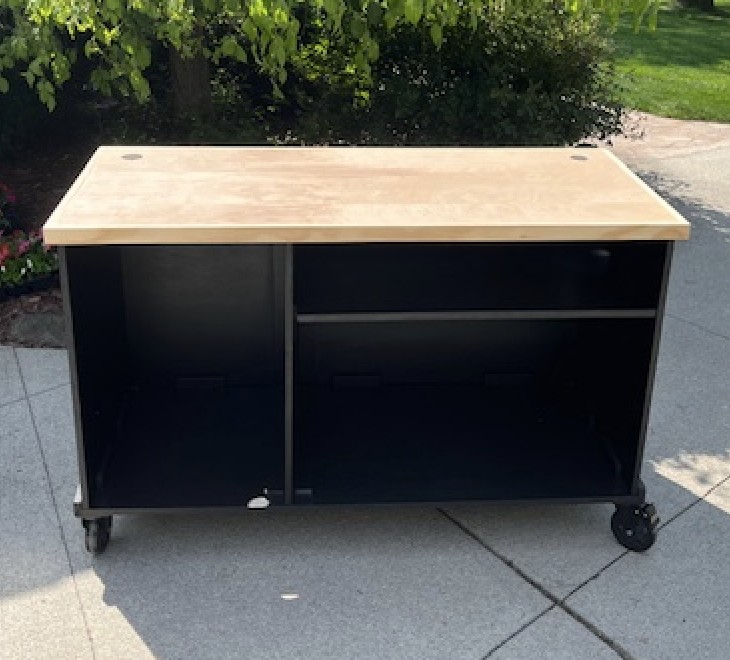 Open back of the chevron cart with interior storage and a divider shelf