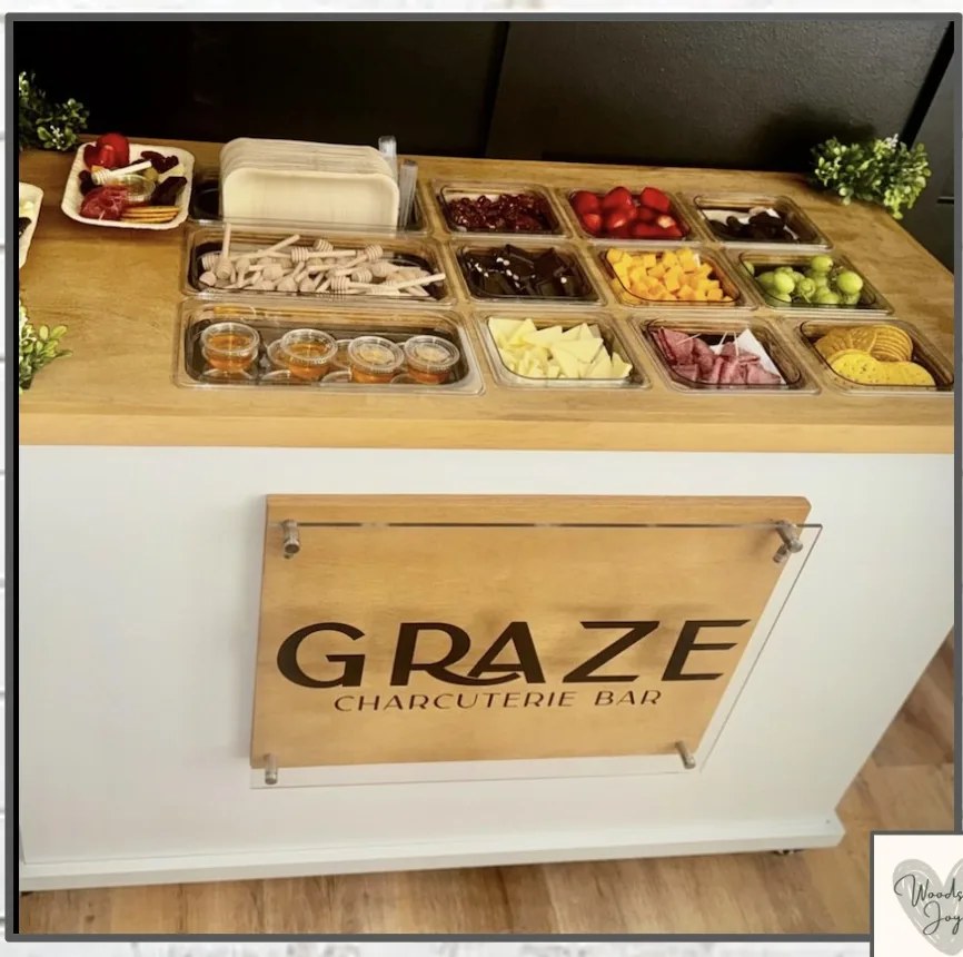 GRAZE Charcuterie Bar: a custom white cart with stainless food wells, styled for grazing spreads
